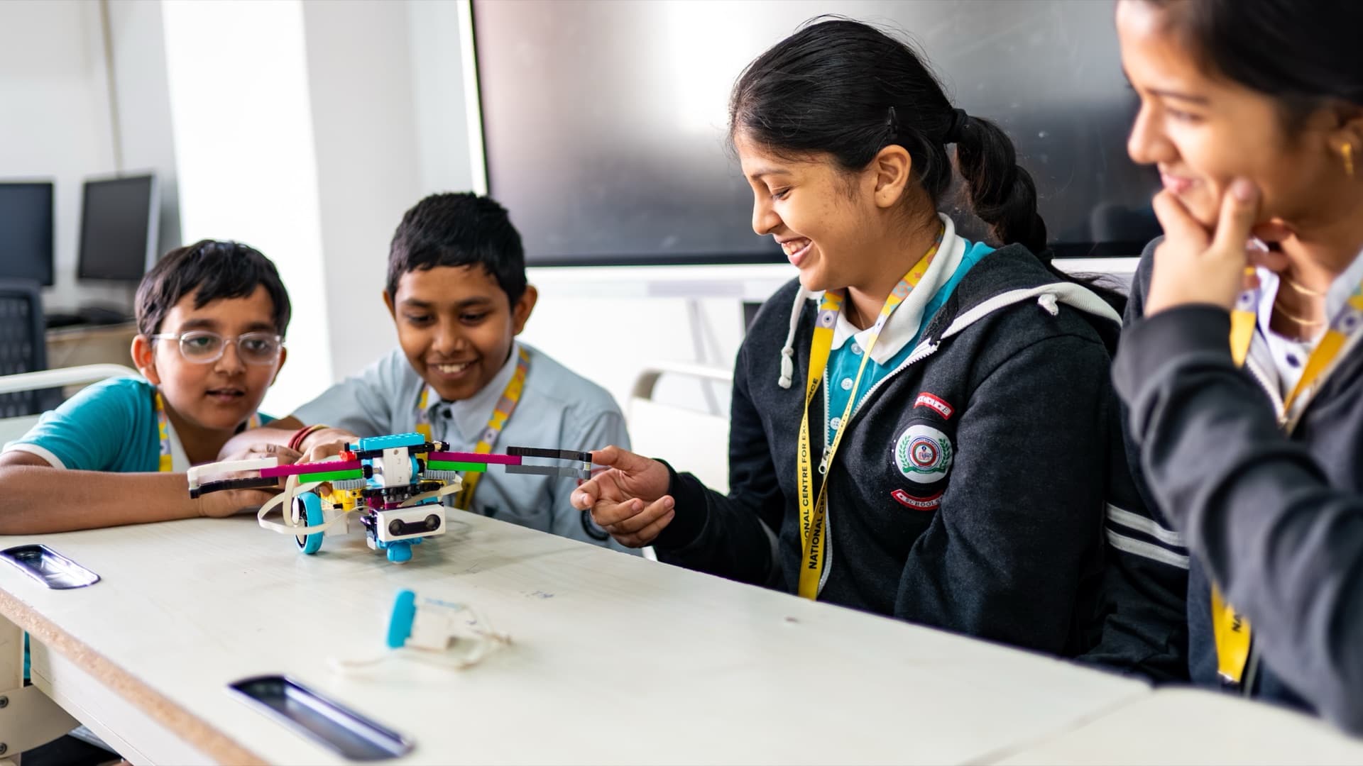 Students gathered around a robotics project at NCFE