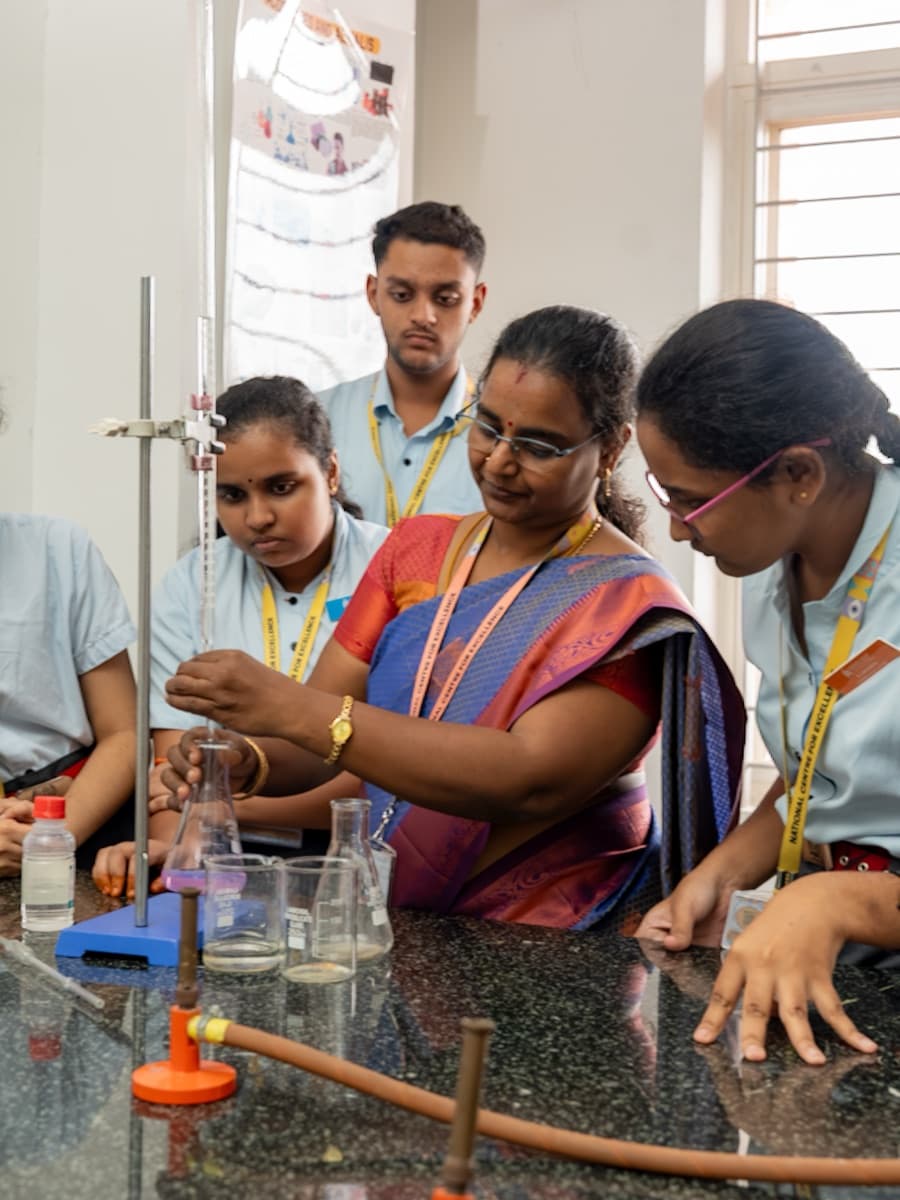 A teacher leading a science experiment with students